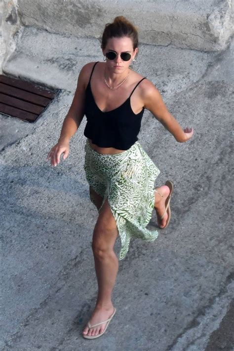 Emma Watson on the beach in Positano, Italy .